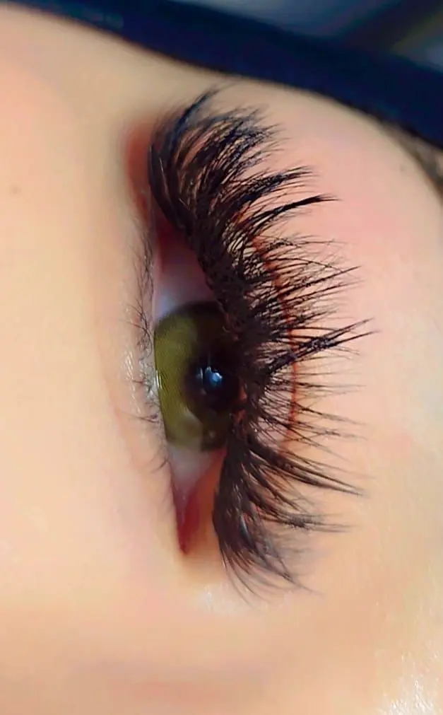 Close-up of mega volume eyelash extensions with bold dramatic fullness.